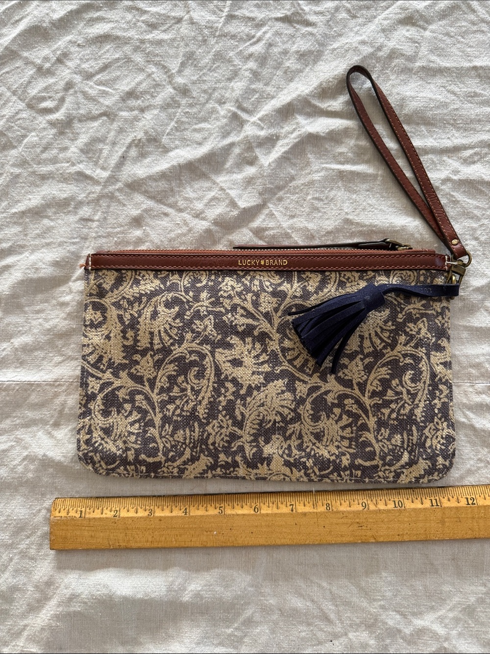 Lucky Brand Brown and Beige Floral Wristlet with Navy Tassel